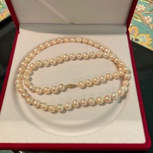 26” strand of freshwater pearls with 14k gold clasp